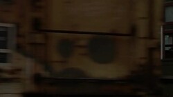 A freight train passes a trolley full of passengers in New Orleans. Stock Footage