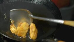 four Fried Chicken is  cooking in black pan Stock Footage