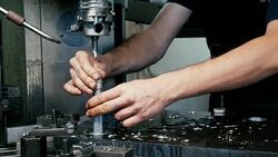 Man in factory measure  hole in steel with vernier caliper. Stock Footage