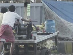 WS PAN Sugarcane juice vendor pushing his cart on city road / Patna, Bihar, India Stock Footage
