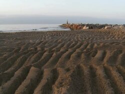 WS View of beach and light house / Marbella, Andalusia, Spain Stock Footage