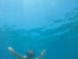 HD SLOW MOTION: Underwater Shot Of A Swimmer Stock Footage