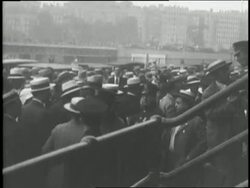 A large crowd of people enters a sports stadium. News Clip