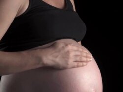 HD: Happy Pregnant Woman Caressing Her Belly Stock Footage