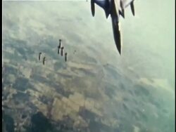 1964 AERIAL MS SLO MO Bombs dropping from US fighter plane over countryside during Vietnam War / North Vietnam Stock Footage