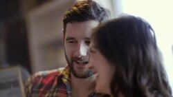 Young couple inspect and discuss vintage vinyl record in music shop Stock Footage