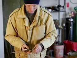 MS TU TD Metalsmith working in his studio / Santa Fe, New Mexico, United States    Stock Footage