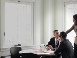 MS coworkers discussing project in office conference room Stock Footage