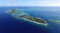 Wide shot of Kanton Island settlement and WWII junk Stock Footage
