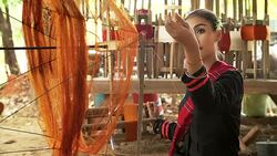 Beautiful asian woman is weaving cotton with a traditional tools. Stock Footage
