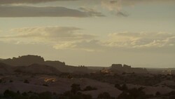 Wide panning shot of rock formations in desert / Moab, Utah, United States Stock Footage