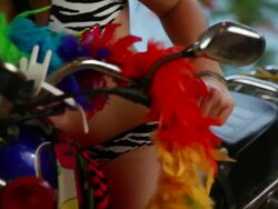 CU PAN  Female model  in bikini and hand on handlebar of motorcycle / Montezuma, Punteranes, Costa Rica Stock Footage