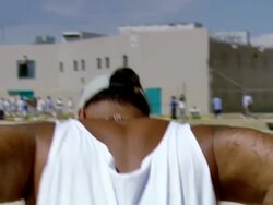 WS DS Prisoner doing dips on bars in prison yard / Los Angeles, California, USA Stock Footage