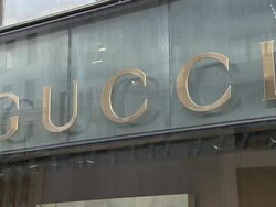 CU, Gucci sign on building exterior, Fifth Avenue, New York City, New York, USA Stock Footage