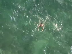 WS Man swimming in sea, UNESCO World Heritage Site / Dubrovni, Croatia Stock Footage