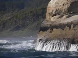 waves against coast rock Stock Footage