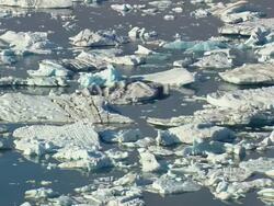 WS AERIAL View of Jokulsarlon icebergs / Iceland Stock Footage