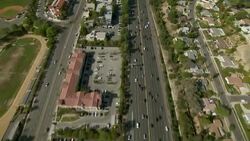 Tracking shot over freeway in Los Angeles County, California. Stock Footage