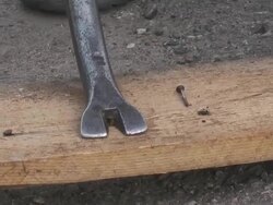 pull off nails from plank Stock Footage