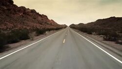 Driving shot through desert mountain pass (fast motion) Stock Footage