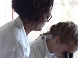 CU School teacher assisting children in science lab Stock Footage