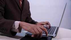 Businessman using laptop with digital pen Stock Footage