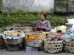 MS Vendor selling blossom for ceremony in market / Ubud, Bali, Indonesia Stock Footage