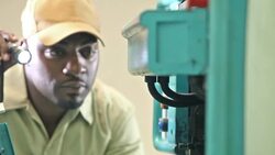 Repairman examining equipment with flashlight Stock Footage