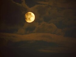 MS Sun being partly obscured by storm clouds / Masai Mara, Kenya Stock Footage