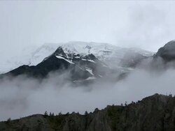 T/L cloud over silhouetted Annapurna 2, dawn, Himalayas Stock Footage