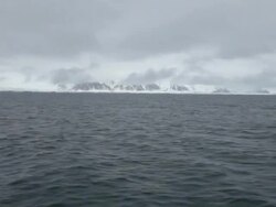 Cloudy and stormy weather at Isfjorden, the second longest fjord in the Norwegian archipelago of Svalbard; mountains covered by snow Stock Footage