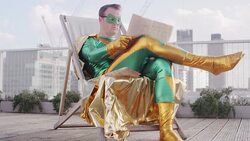 Superhero reading newspaper on city rooftop Stock Footage