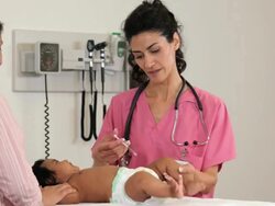 "PAN hispanic medical worker giving a vaccination to a hispanic infant patient/Richmond,Virginia, USA " Stock Footage