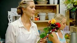 Florist arranging rose bouquet in flower shop Stock Footage