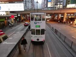 MS POV Railcar moving through busy street / Hong Kong, China Stock Footage