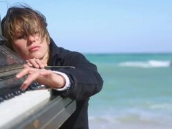 young woman playing on an old piano Stock Footage