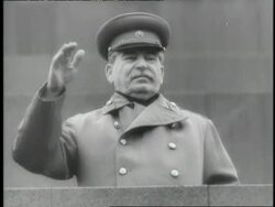 Russian dictator Joseph Stalin waves from a balcony. News Clip
