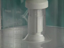 Woman cutting cucumber in blender Stock Footage