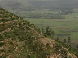 Green hill with stone enclosures Stock Footage