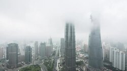 fog covering Shanghais skyscrapers Stock Footage