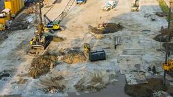 High view construction site machinery with crane and building Stock Footage
