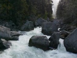 Cascading Merced River with Vernal Fall in background in Yosemite National Park, California Stock Footage