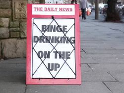 Newspaper Headline Board - Binge drinking on the up Stock Footage