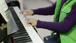 boy playing the piano Stock Footage