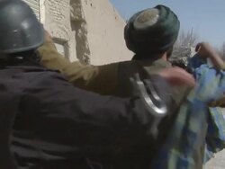 MS ZI Soldiers investigating the local people / Musa Qala, Helmand Province, Afghanistan. Stock Footage