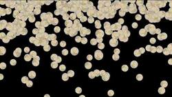 Silver coins slowly fall against a black background changing to silhouettes. Stock Footage