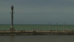 An ornate tower decorates a pier over the ocean. Stock Footage