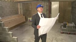 Architect with Blueprints, plans on Construction / Building site:  CRANE Stock Footage