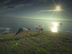 MS POV TS SLO MO Couple practicing yoga overlooking Pacific Ocean / Port Orford, Oregon, United States Stock Footage