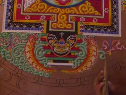 CU ZO Two men working on completing mandala of sand / Kathmandu, Central Region,Nepal Stock Footage